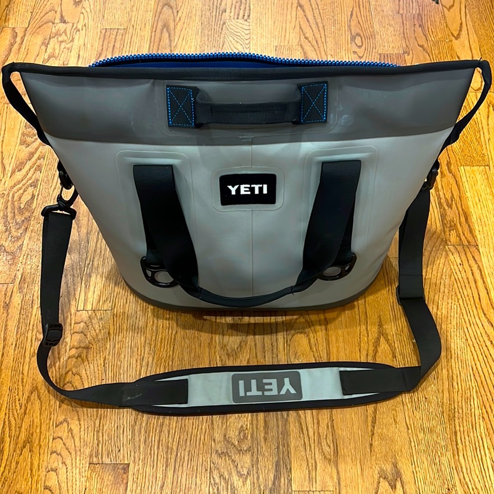 YETI Hopper Two 30 Soft Cooler with Zipper. Grey and black with blue interior.